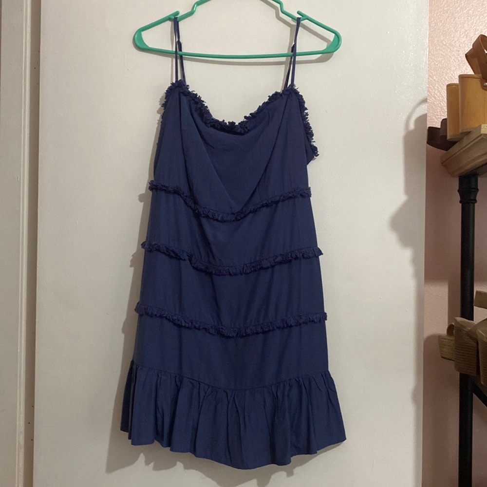 Size M. Mini dress. Fridge detail on front. Ruffle bottom. NWOT.